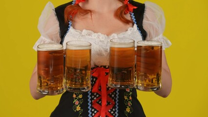 Close up yellow background isolated shot of an unrecognizable young German woman, waitress wearing...