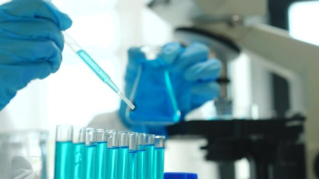 Close up scientist conducting precise virus lab test, scientific methodology, microbiologist conducting virus detection and testing in progress