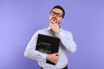 Thoughtful accountant with calculator on violet background. Space for text