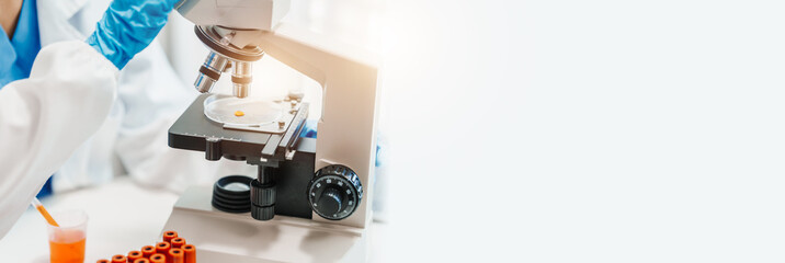 Close up scientist conducting precise virus lab test, scientific methodology, microbiologist conducting virus detection and testing in progress