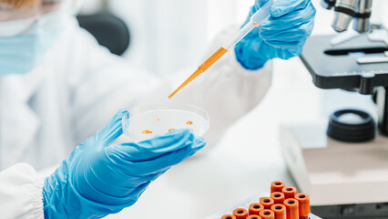 Close up scientist conducting precise virus lab test, scientific methodology, microbiologist conducting virus detection and testing in progress