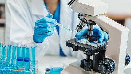 Close up scientist conducting precise virus lab test, scientific methodology, microbiologist...