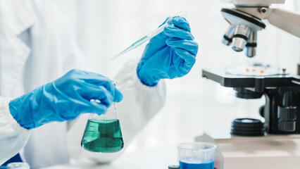 Close up scientist conducting precise virus lab test, scientific methodology, microbiologist...