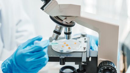 Close up scientist conducting precise virus lab test, scientific methodology, microbiologist conducting virus detection and testing in progress