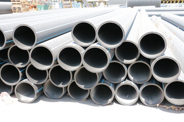 PE pipe plant, Industrial PE pipes with blue line for gas and water. HDPE pipe, Polyethylene PE100 pipe. Polyethylene pipe plant