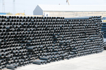 PE pipe plant, Industrial PE pipes with blue line for gas and water. HDPE pipe, Polyethylene PE100 pipe. Polyethylene pipe plant