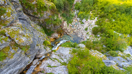 Aerial view of Grunas Waterfall in Theth National Park, Albania. Albanian Alps