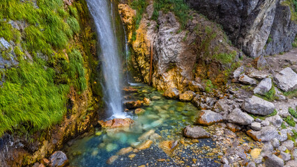 The Grunas waterfall in Theth National Park, Albania. Albanian alps - obrazy, fototapety, plakaty