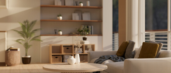 A minimal wooden coffee table with ceramic vases in a cozy Scandinavian living room interior style.