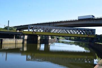Fototapeta na wymiar Old Railroad Bridge across the Moselle with a Highway bridge above