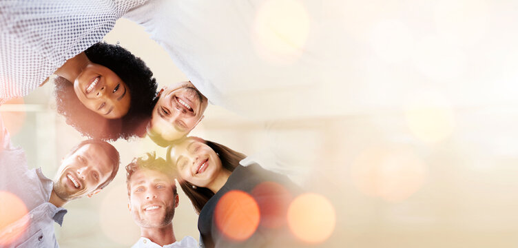 Business people, huddle and diversity, team with banner and low angle, smile in portrait with mission and trust. Mockup space, bokeh and strategy with support, collaboration and corporate group