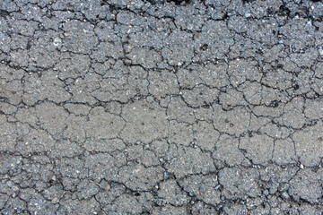 old broken road with cracked asphalt