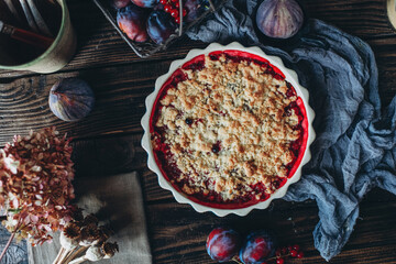 Homemade cakes, sweet plum cake on a dark background, rustic table setting