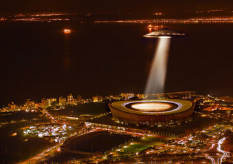 UFO, light and city in night, alien invasion and search with light on stadium in Cape Town. UAP...