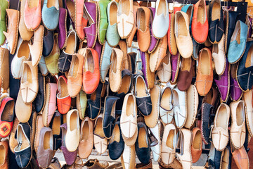 Traditional turkish leather shoes named yemeni. Colorful handmade leather slipper shoes displayed...