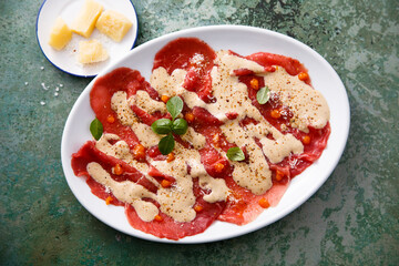 Beef carpaccio with berry sauce