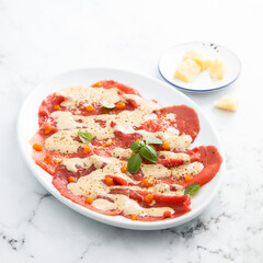 Beef carpaccio with berry sauce