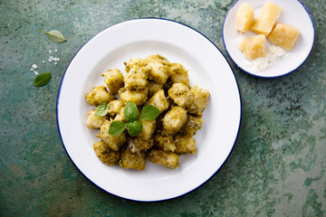 Traditional potato gnocchi with pesto sauce