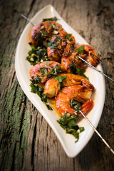 tasty fresh shrimp skewers on plate