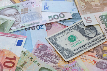 Fototapeta na wymiar close up of multiple currencies banknotes