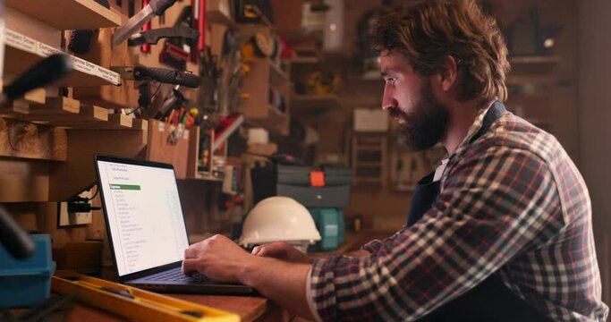 Man, workshop and carpenter with a laptop, connection and typing with email notification, online reading or invoice. Person, employee or entrepreneur with a pc, search internet or website information