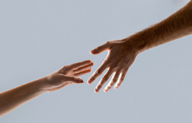 Helping hand outstretched, isolated arm, salvation. Two hands, helping arm of a friend, teamwork