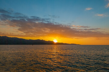 Corse (France) - Corsica is a big touristic french island in Mediterranean Sea, with beautiful beachs and mountains. Here a view of the historical center of Saint Florent port village at sunset