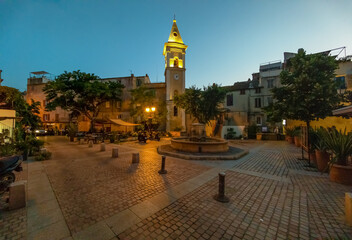 Corse (France) - Corsica is a big touristic french island in Mediterranean Sea, with beautiful beachs and mountains. Here a view of the historical center of Saint Florent port village at sunset