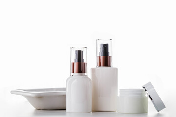 Cosmetic packaging unbranded white on white background.