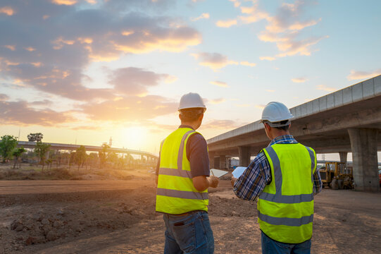 The chief civil engineer is introducing inspection of a road or expressway construction project under the road to an intern. At the expressway construction site