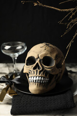 Halloween table setting, skull in a black bowl