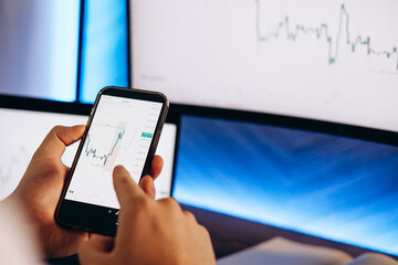 Man trader working on computer on exchange market