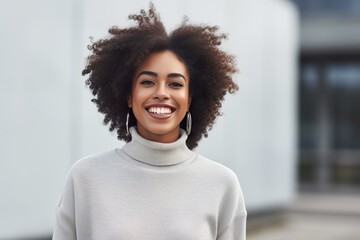 Portrait of a happy smiling modern girl of African American ethnicity with curly hair - obrazy, fototapety, plakaty