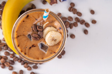 Blended banana coffee. Cold latte coffee and banana non-dairy, vegan diet drink with frozen bananas...
