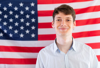 Student on background of flag of the United States of America