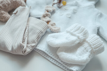 A set of baby clothes for a newborn in pastel colors, top view