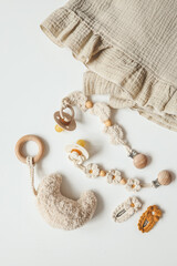 Baby things, fashion for newborns. Pacifiers, holder, plaid top view, flat lay, space for text.