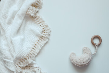 Baby muslin blanket and holder top view on white background