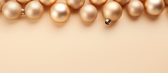 Christmas baubles in gold placed on a isolated pastel background Copy space