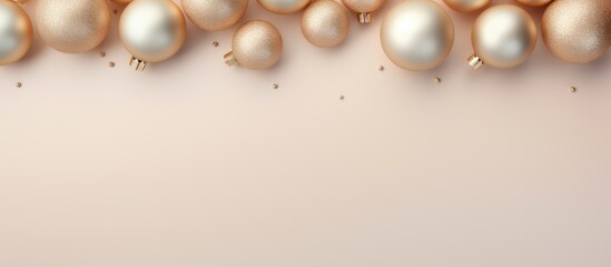 Christmas baubles in gold placed on a isolated pastel background Copy space