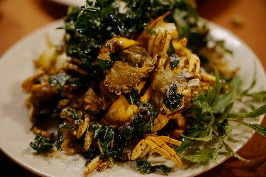 Crispy delicious rice field crabs stirred fried with lolot leaves