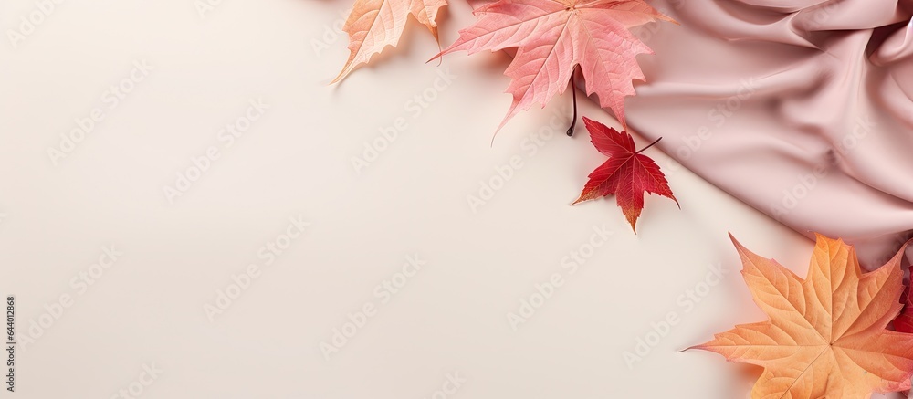 Aufkleber autumn composition with maple leaves and beige fabric on a isolated pastel background copy space min