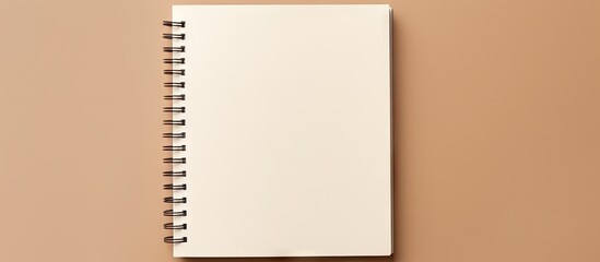 Blank notebook with brown ribbon isolated on a isolated pastel background Copy space for mockup design seen from above