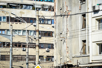Big cracks on the facade of an old building in Bucharest