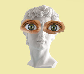 Ancient statue head with big green eyes collage on yellow background.