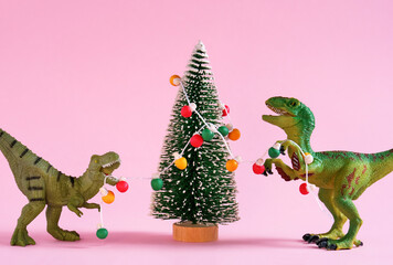 Happy cute green dinosaurs decorate Christmas tree with retro bulb garland. Christmas and new year...