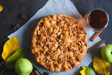 Apple pie with cinnamon. Charlotte, a sweet dessert made from apples baked in dough