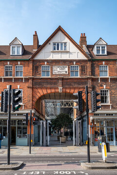 London, UK - 25 March 2022:  Old Spitalfields Market entrance, in the East End of London near Shoreditch. A vibrant antique, food and artisan craft market originally dating back to the 13th century.
