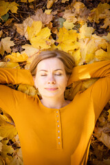 Beautiful woman in autumn park. happiness, harmony, self-care, relaxation and mindfullness