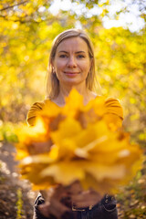 Beautiful woman in autumn park. happiness, harmony, self-care, relaxation and mindfullness